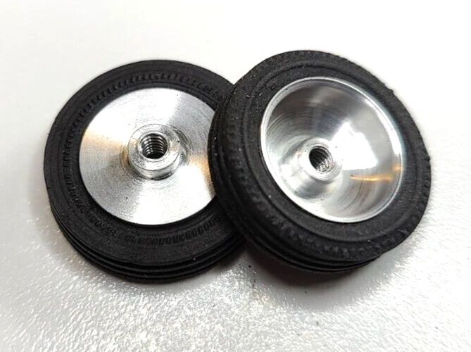 Wheels, 1960's vintage. 24mm dia. x 5.5mm wide. 15/16" X 7/32" 5-40 threaded axle.