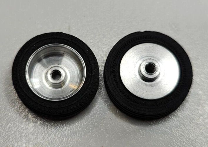 Wheels, 1960's vintage. 24mm dia. x 5.5mm wide. 15/16" X 7/32" 5-40 threaded axle.