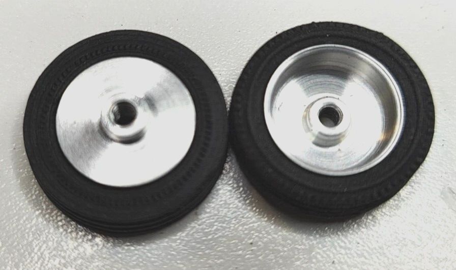 Wheels, 1960's vintage. 24mm dia. x 5.5mm wide. 15/16" X 7/32" 5-40 threaded axle.