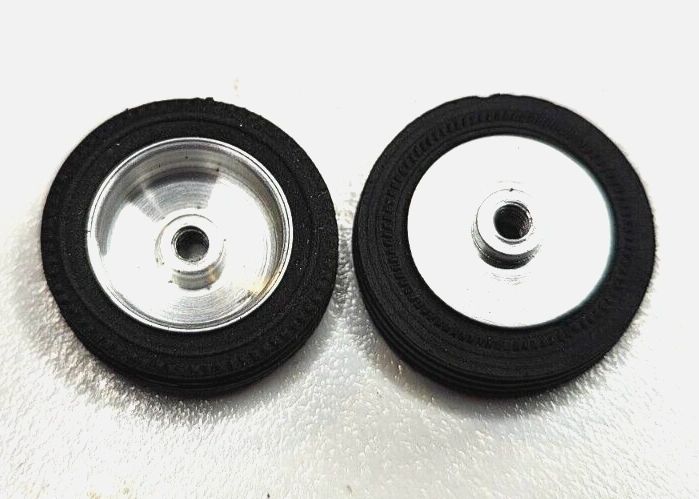 Wheels, 1960's vintage. 24mm dia. x 5.5mm wide. 15/16" X 7/32" 5-40 threaded axle.